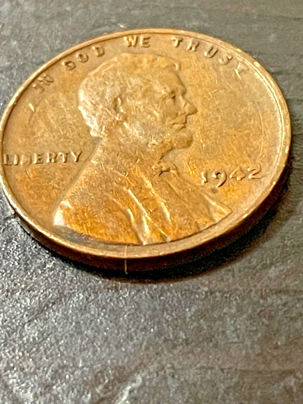 1942 Wheat penny chip on Liberty Trust date 42