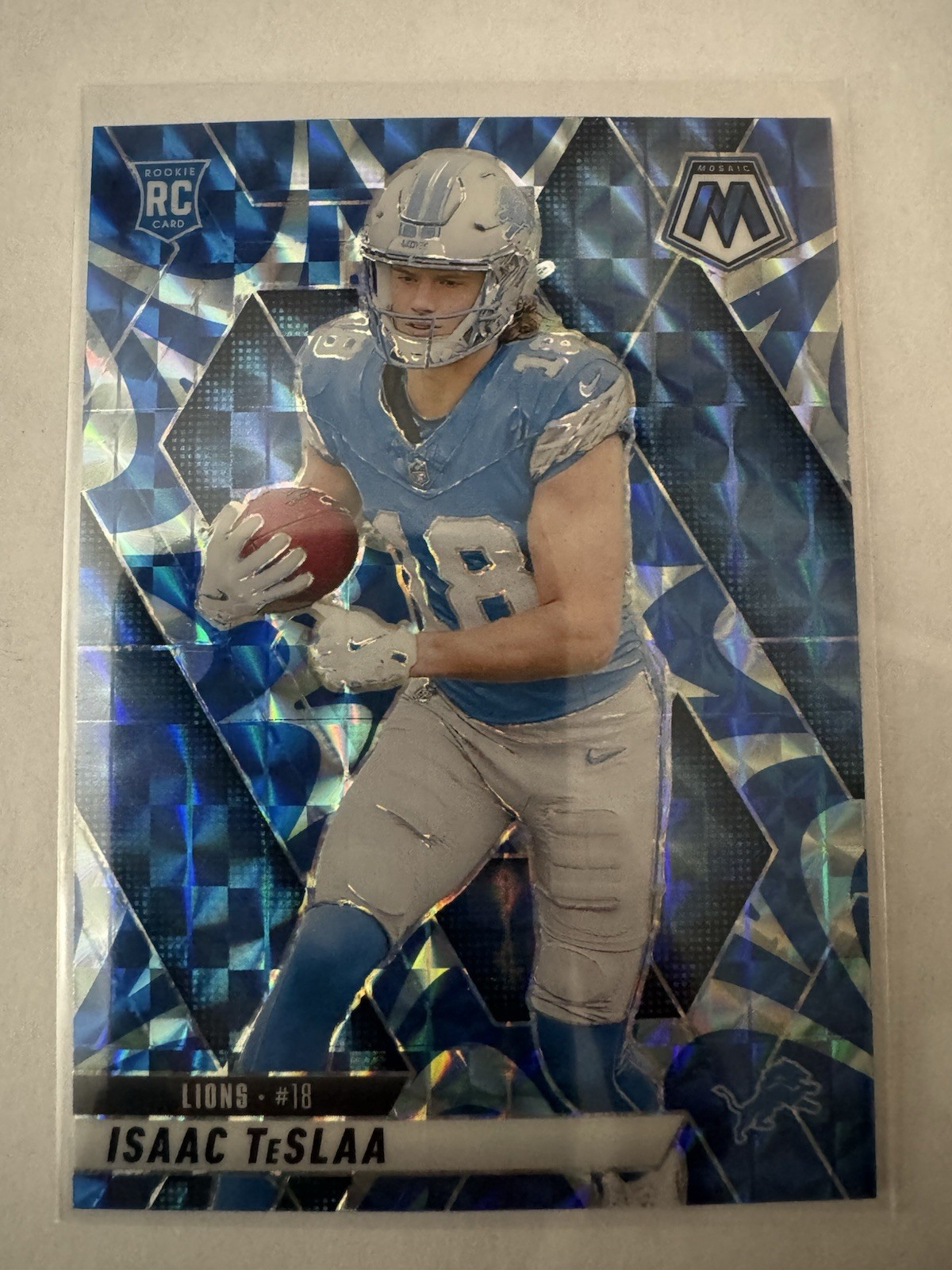 2025 Panini Mosaic - Isaac Teslaa RC #319 Reactive Blue Mosaic Prizm