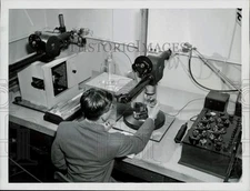 1956 Press Photo Physicist A.G. Strang works with a gauge block in Washington