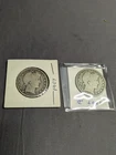 Two 1907 Barber Liberty Half Dollar Coins.