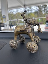 antique Indian brass figurine depicting a king riding an elephant with 4 wheels