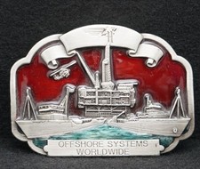 WB09102 *NOS* VINTAGE 1983 *HALLIBURTON* OFFSHORE SYSTEMS WORLDWIDE BUCKLE