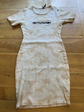 pretty little thing dress size 8 used. small hole by label. See Pics