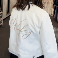 White Vegan Leather Trending Bridal Jacket With Light Gold Cursive Bride Writing