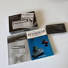 SHARP pocket computer PC-1245 with introductory book