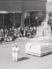 RPPC. Navy parade. Black hills studios. Sutherland meats. South Dakota. (M9)