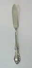 INTERNATIONAL "WILD ROSE, NEW" STERLING SILVER MASTER BUTTER KNIFE, 35 grams