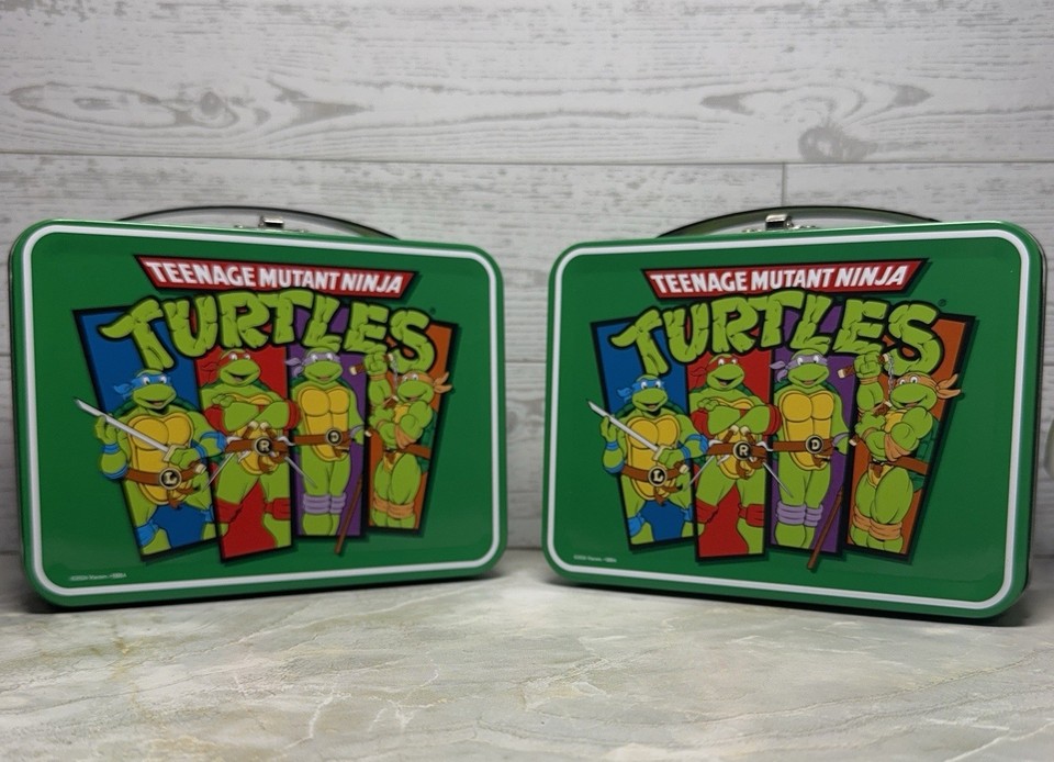 Twin-pack of retro TMNT mini tin lunchboxes — tiny, nostalgia-packed, and genuinely displayable on any shelf.