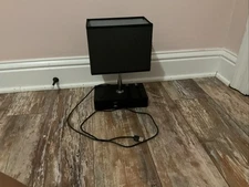 Black Lamp, With A Touch On Button, Two Phone Holders, And Two USB Ports.