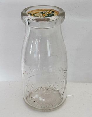 Clarke s Gallup, NM Half Pint Clear Embossed Milk Bottle