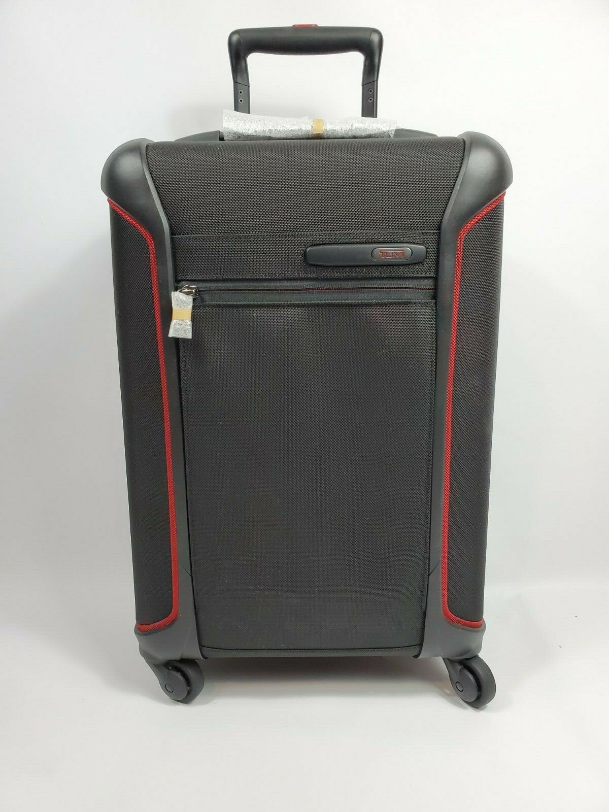 tumi red carry on