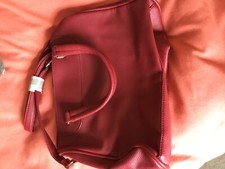 Natalie Anderson red handbag