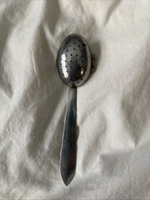 vintage stainless steel tea infuser spoon used for steeping loose-leaf tea