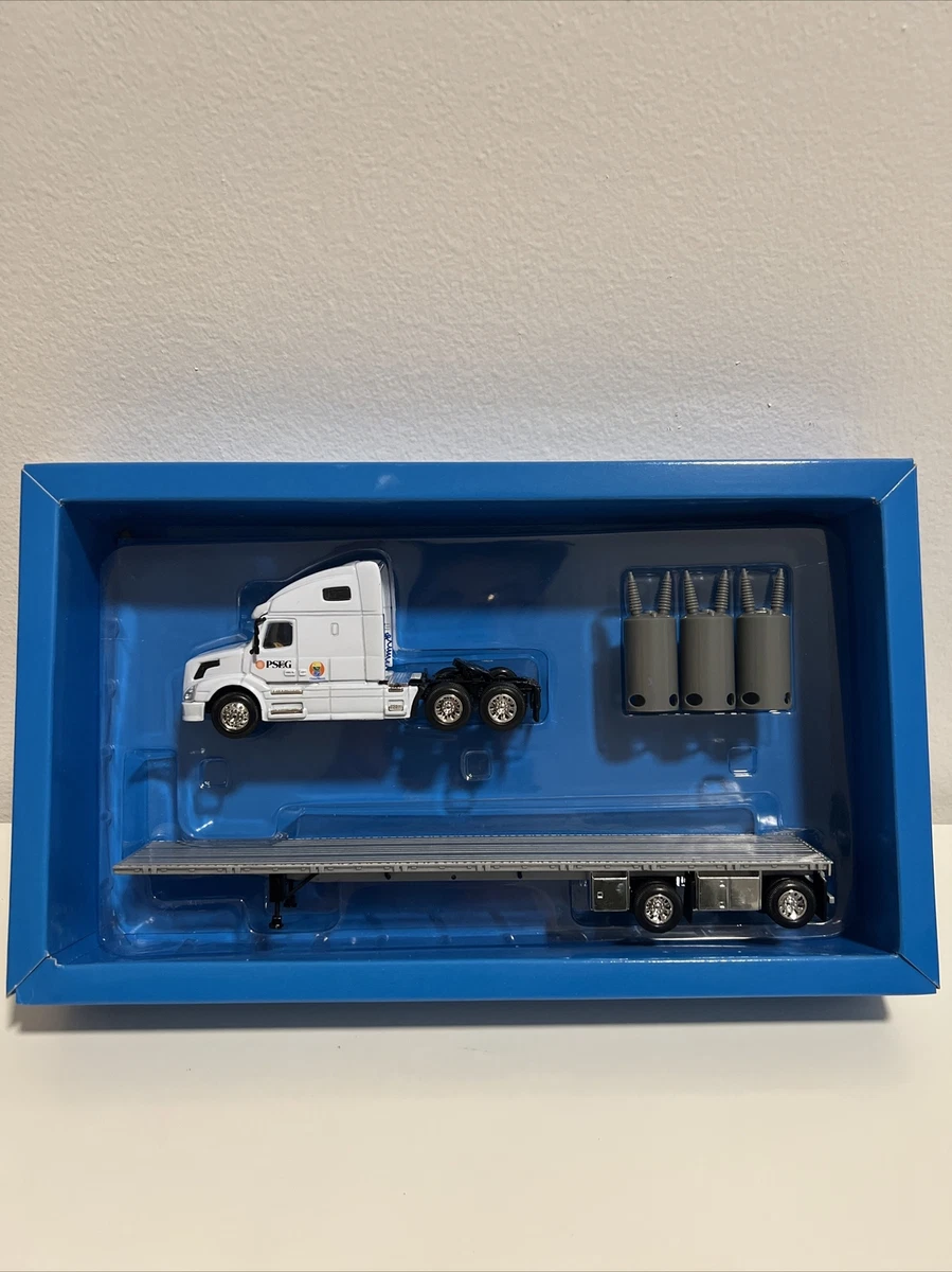 DG PRODUCTIONS 1:64 VOLVO PSEG FLATBED TRUCK W/BOX AND PACKAGING - VERY RARE!