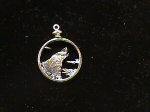 Hand cut US Quarter with a Howling wolf made as a pendant