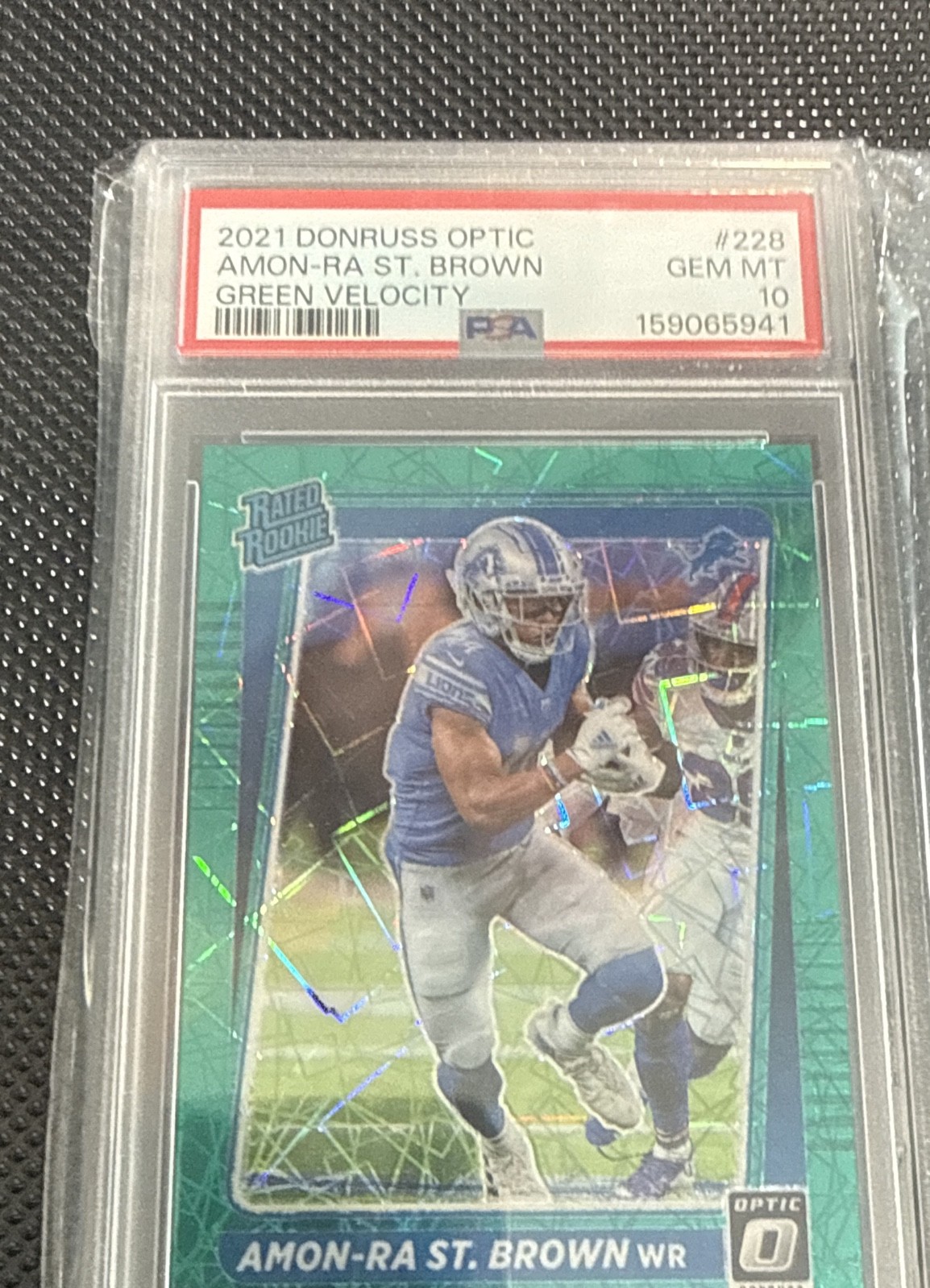 Amon-Ra St. Brown Panini Donruss Optic #228 Green Velocity
