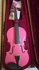 A PINK VIOLIN 4/4 WITH A BOW AND A RED VELVET CASE.