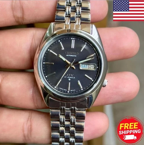 Seiko 5 SNXS Men's Watch - Black Dial, Silver Band, 7009. Classic, durable