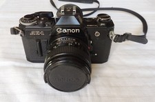 Appareil Photo argentique Canon AE-1 + objectif canon 28 mm - Non testé, bloqué