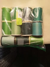 sewing thread used Green preowned mostly full 11 spools.