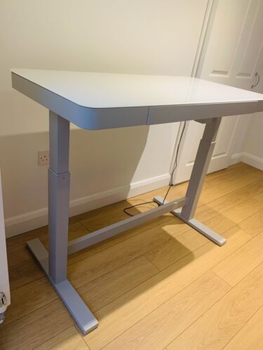 Standing computer desk with adjustable height levels.