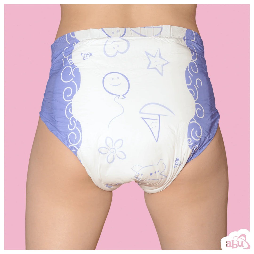 White ABU Cushies plastic backed diaper with blue and purple floral and star print, worn on a pink background.