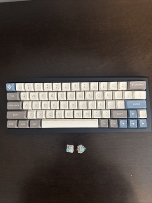 Custom keyboard With Teal Switches and Polycarbonate Plate.