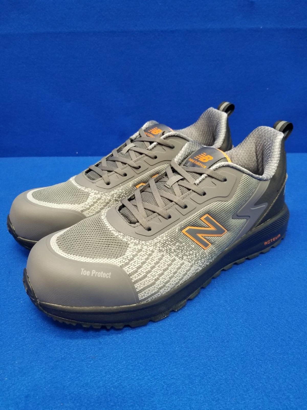 Scarpa da ginnastica New Balance uomo taglia 13 2E punta composita grigio arancione
