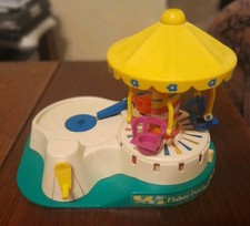 FISHER PRICE VINTAGE CHANGE A TUNE CAROUSEL ET 3 DISQUES 