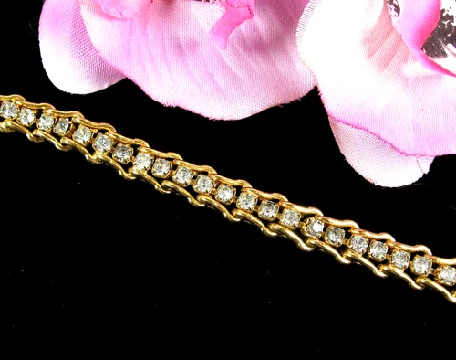 TENNIS BRACELET Vintage Clear Rhinestones Goldtone Curved Over Links 7"