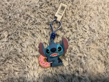 The product is a 3D Key Chain of Stitch from Disney's Lilo  Stitch With donut