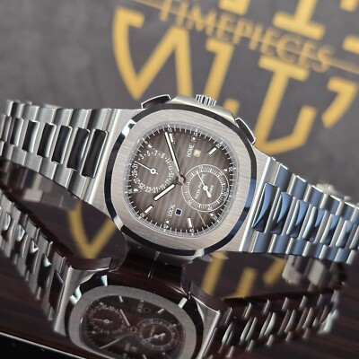 MINT PATEK PHILIPPE NAUTILUS 40.5MM TRAVEL TIME 5990/1A-001 STAINLESS STEEL B&P