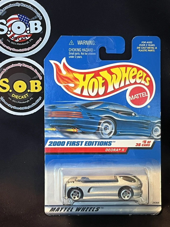 Hot Wheels Deora II Custom Surf Pickup 2 tablas de surf plateadas diecast selladas casi nuevo estado Foto 2 de 3