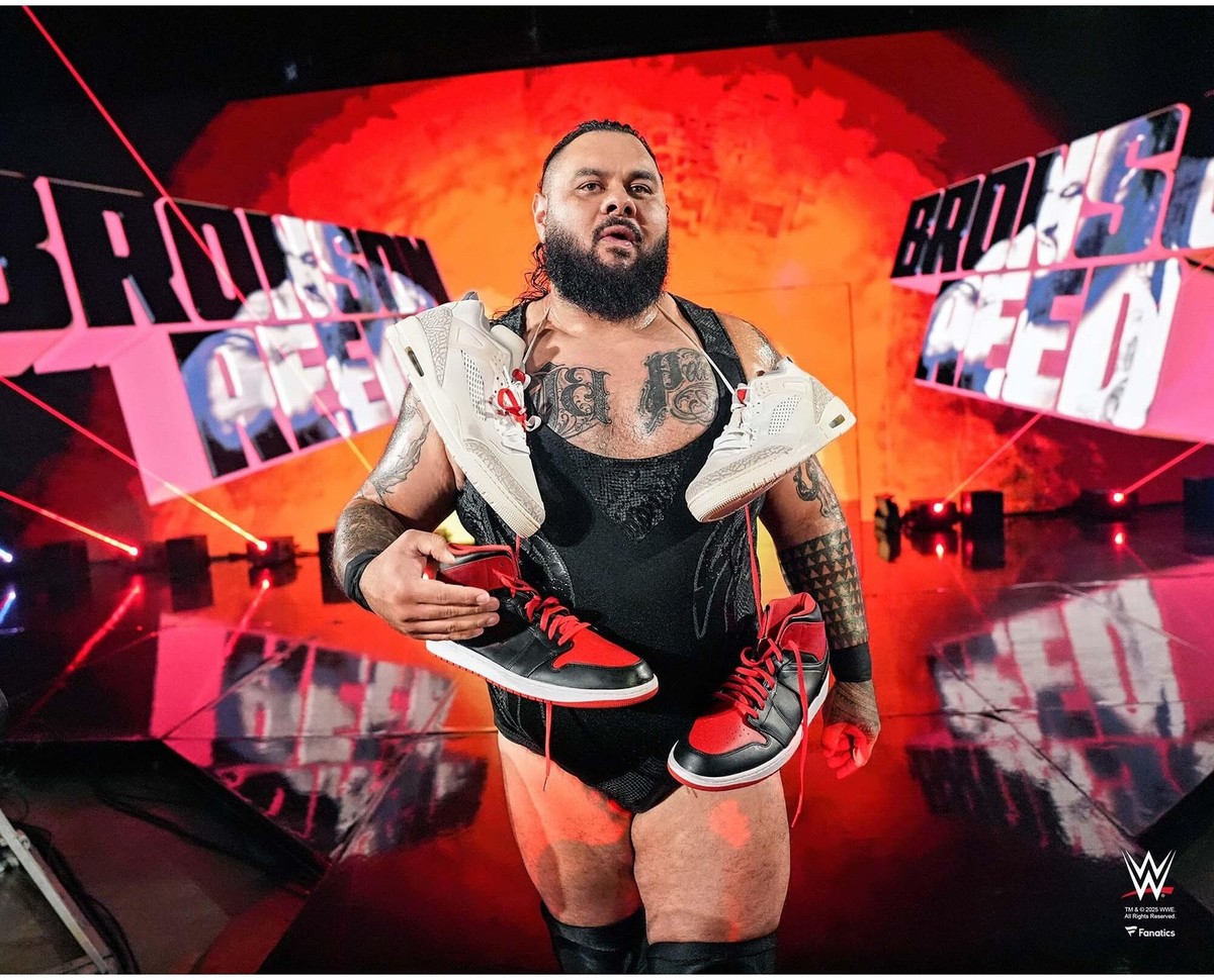 Bronson Reed WWE Unsigned Entrance Sneakers Around His Neck Photograph — product photo 1 of 1