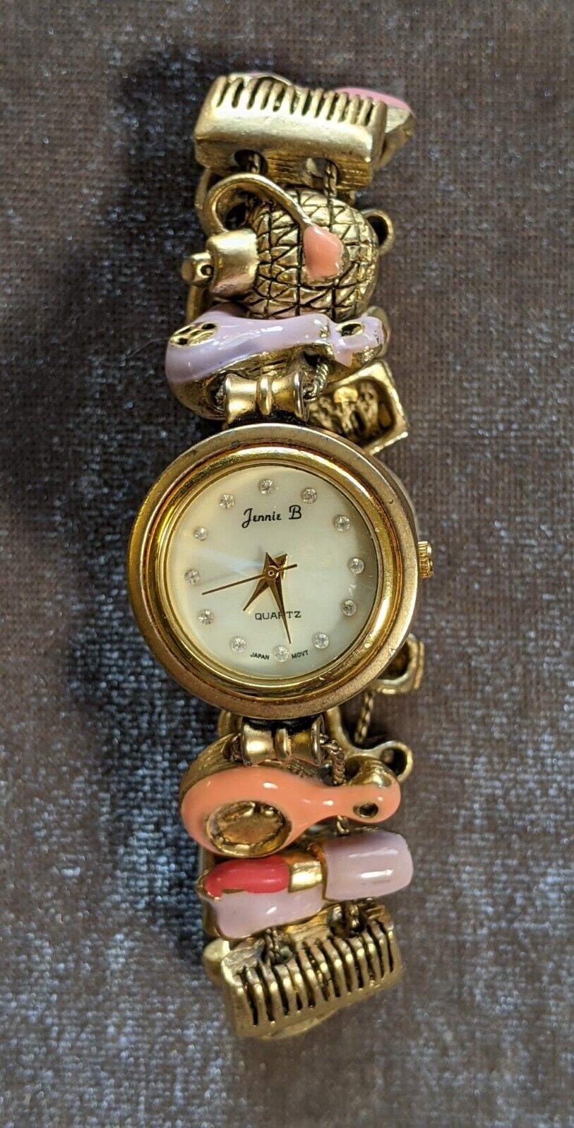 Jennie B Gold Tone Watch With Beauty Charms H10