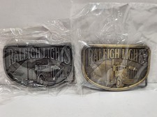 Lot Of 2 Vintage Raleigh Lights Belt Buckle Trucker 1980 Tobacco Cigarettes NOS