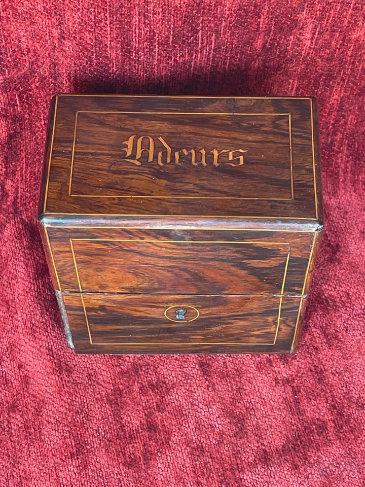 A Napoleon III-era perfume bottle case with marquetry inlay — a 19th-century luxury object that looks like it belongs in a Paris boudoir.