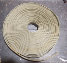 Flat telephone wire for floors 4 conductor, Over 25 feet roll,old but never used