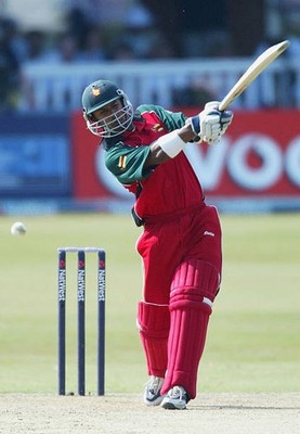 Dion Ebrahim of Zimbabwe hits out during third match of NatWest on- Old Photo