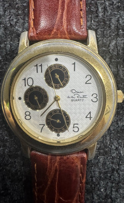 Oscar de la Renta Quartz White Textured Dial Day/Date Gold Case Brown Strap