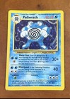 Poliwrath holo rare Pokémon card 13/102 with blue spiral-patterned Poliwrath artwork, 90 HP, and attack details.