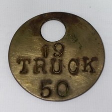 VINTAGE 1950 BRASS TRUCK TAG BADGE KEY BAG HAND PUNCHED TRANSPORTATION AMERICANA