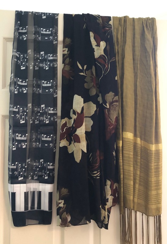 Lot of 3 Womens Long Fashion Scarfs. 1=Blk/Music 1=Golden 1=Black w/Floral Print