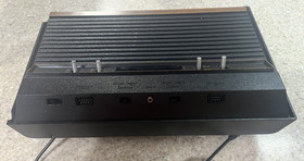 ATARI 2600 console with 25 games , 2 controllers and cords
