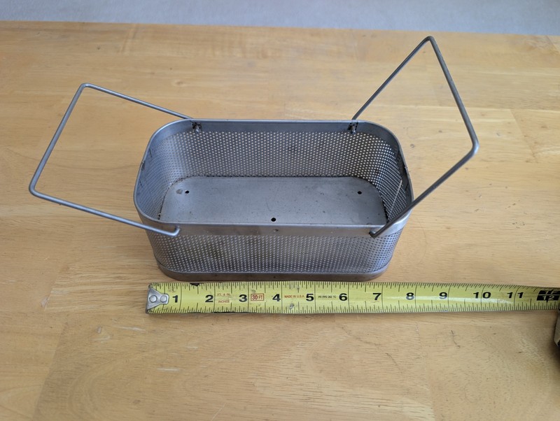 Stainless steel instrument sterilization tray basket.