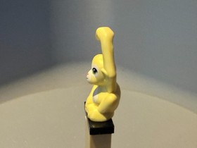 bright light yellow LEGO Friends monkey figure with lime eyes 41032