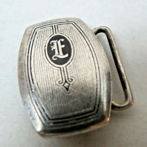 silver belt buckle with initials