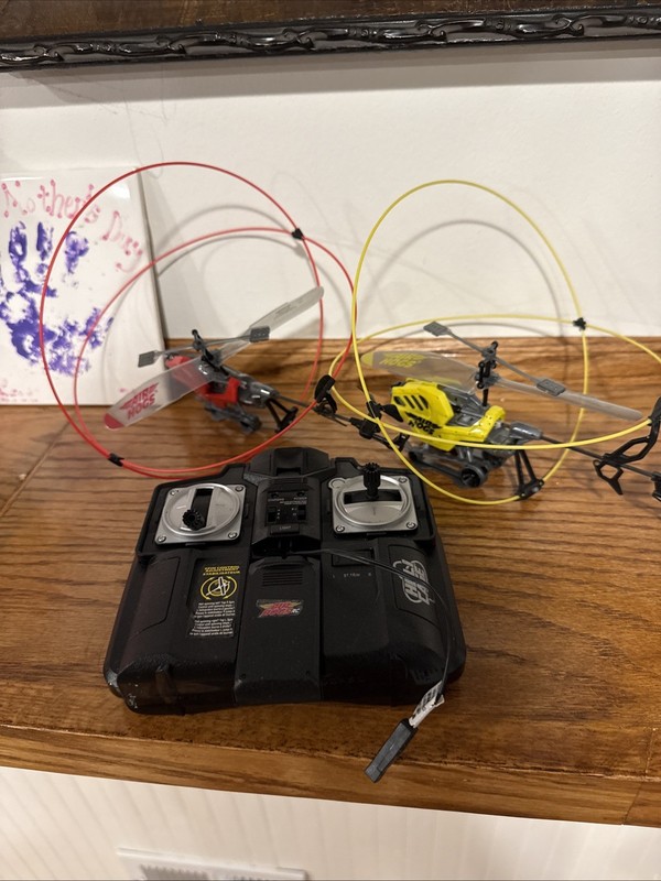 Two Air Hogs RC Helicage Helicopters — One Remote