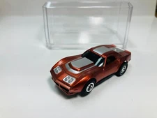 AFX tras  CANDY  COPPER   CORVETTE  AW Chassis  & Display case Aurora NEW!
