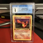 Pokémon TCG Charmander Team Rocket 50 Regular 1st Edition Common CGC 8 NM/Mint